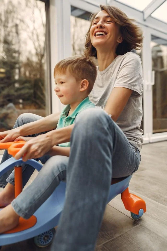 A mother and her son playing at home